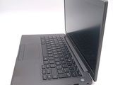 a laptop with a black keyboard on a white surface