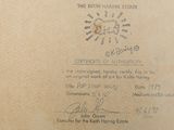a certificate on the back of a box with a picture of a clock