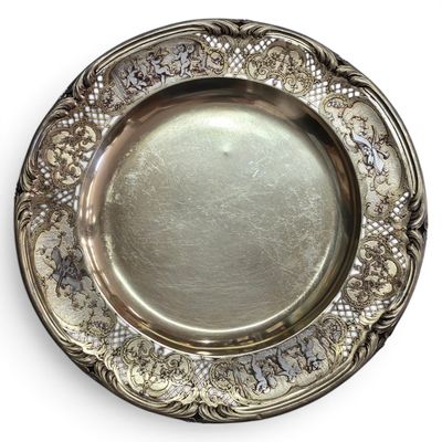 an antique silver plate on a white background with a white background