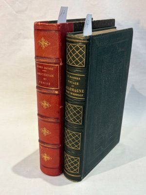 two books sitting next to each other on a white surface
