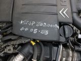 a close up of a car ' s engine with its hood open