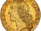 une pièce d'or représentant la tête d'une femme aux cheveux longs