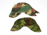 two hats with camouflage print on them sitting next to each other