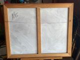 a picture of an easel with a drawing on it