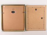 an open box with a picture inside of it on a white surface