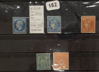 a lot of stamps that are on display in a case