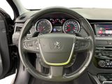 the interior of a car with a steering wheel and dashboard controls