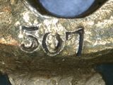 a close up of a statue of a person with a clock on it