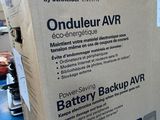 a box of batteries sitting on a blue table