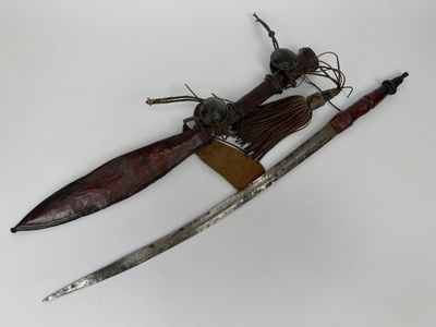 une image représentant un couteau et un porte-couteau posés sur une surface blanche