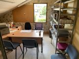 an image of a home office with a desk and chairs
