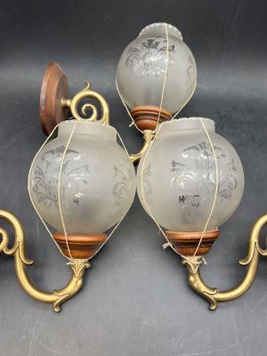 three antique wall sconces with etched glass and brass accents