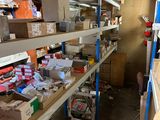 many boxes and boxes on the shelves in the room