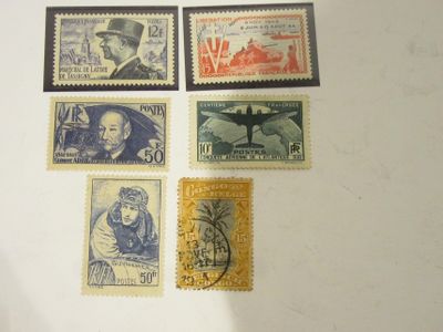 Plusieurs timbres différents sont représentés sur un fond blanc