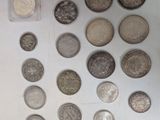 a lot of coins that are sitting on a table