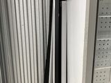a picture of a refrigerator in a store with the door open