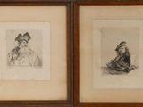 two framed drawings of a woman and a man sitting on the ground