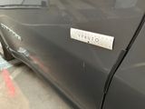 a close up of a car door with a sticker on it