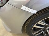 a close up of a car with a sticker on the front of it