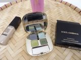 various cosmetics items sitting on a basket on a table