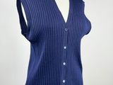 a close up of a mannequin torso wearing a blue cardigan