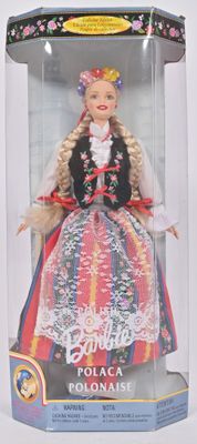 poupée Barbie dans une boîte en plastique, vêtue d'une robe rouge et bleue