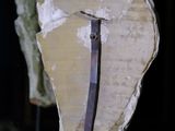 an image of a piece of wood with a piece of metal on it