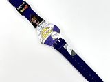 a close up of a watch on a white surface with a white background