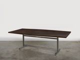 an image of a wooden table with metal legs in a room