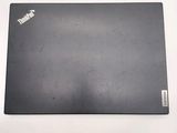 an image of a black laptop computer on a white surface