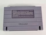 an old nintendo game console sitting on top of a white table