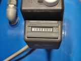 a close up of a control panel on a blue table