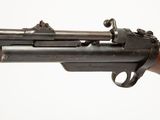 a close up of a gun with a wooden barrel on a white background