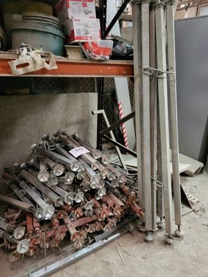 a pile of wood sitting on a shelf in a garage