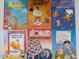 plusieurs livres pour enfants sont alignés sur une surface blanche