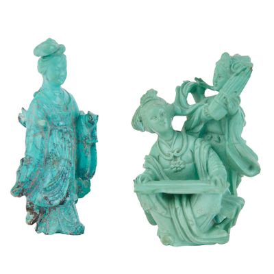 pair of chinese statues of a lady and a lady seated on a bench