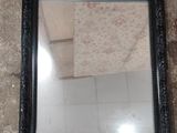 a mirror sitting on the floor in a room