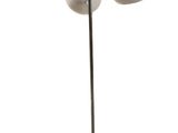 two lamps on a stand with a ball of yarn on the floor