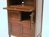 a small wooden cabinet with a drawer on top of it