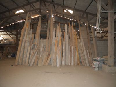 a large pile of wood in the middle of a building