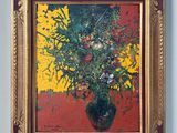 un tableau de fleurs dans un vase sur le mur