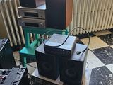 many speakers and speakers sitting on a table in a room