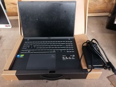 a laptop that is sitting in a box on the floor