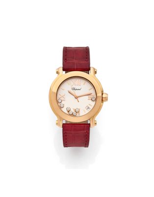 a lady ' s wrist watch with a diamond set dial and red leather strap