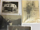 several old photos of people and a train on a table