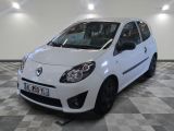 a picture of a small white car parked in a garage