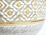 a close up of a vase with a decorative pattern on it