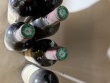 several bottles of wine are stacked on top of each other