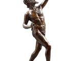 an image of a bronze statue of a man holding a ball