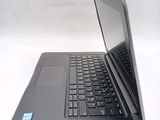 a laptop that is open on a white surface